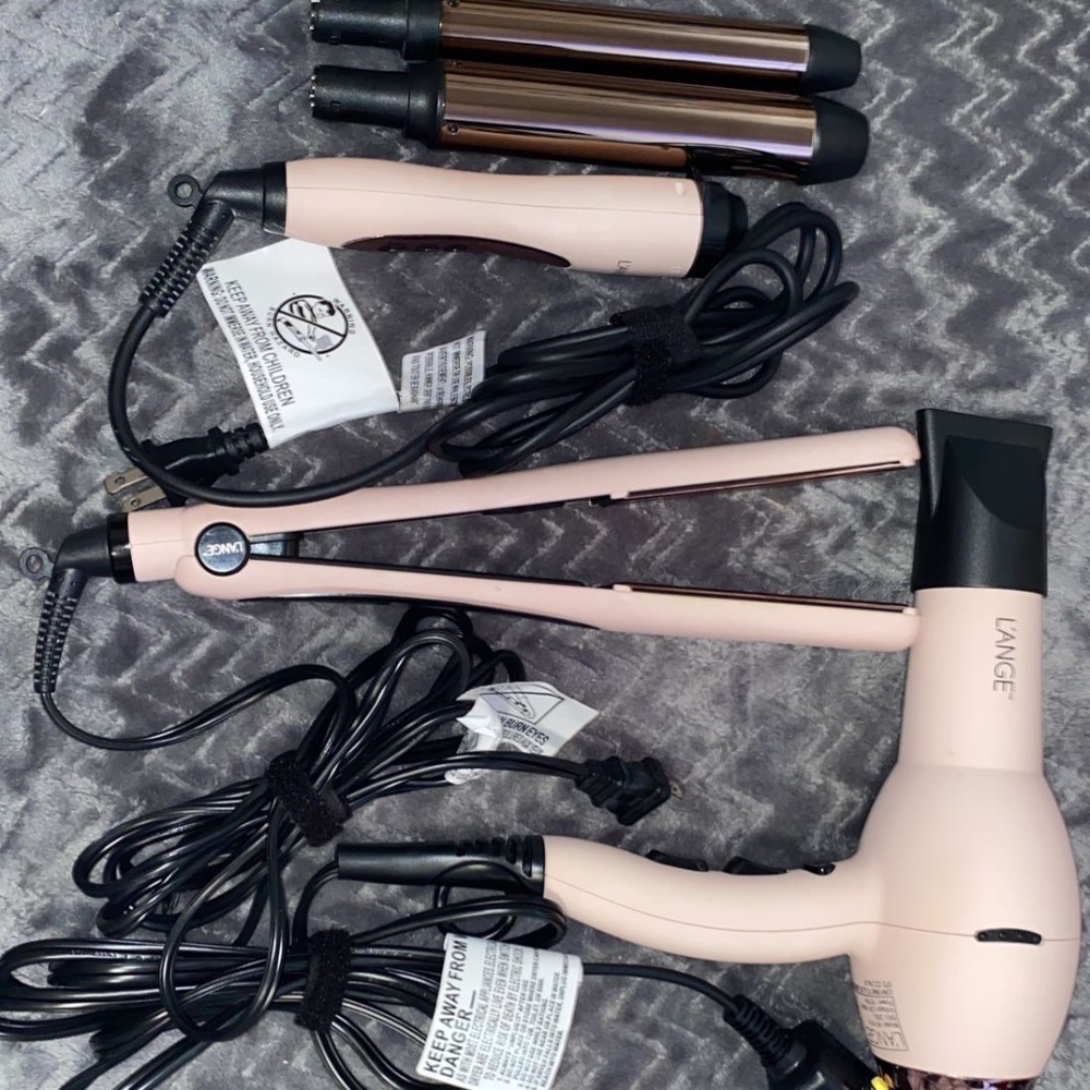 Hair straightener, curler, and blow dryer.